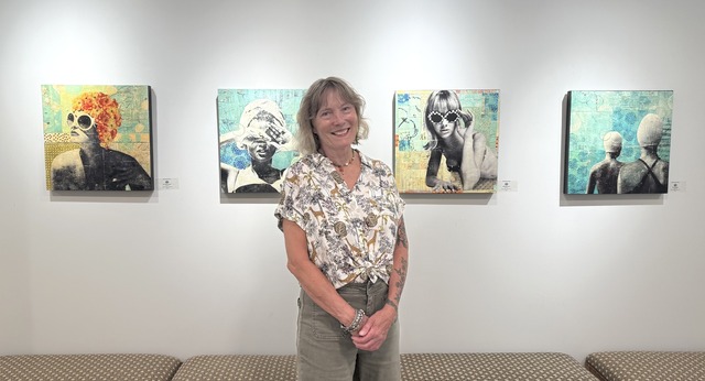 Laura Harvey in front of her exhibit at the gallery